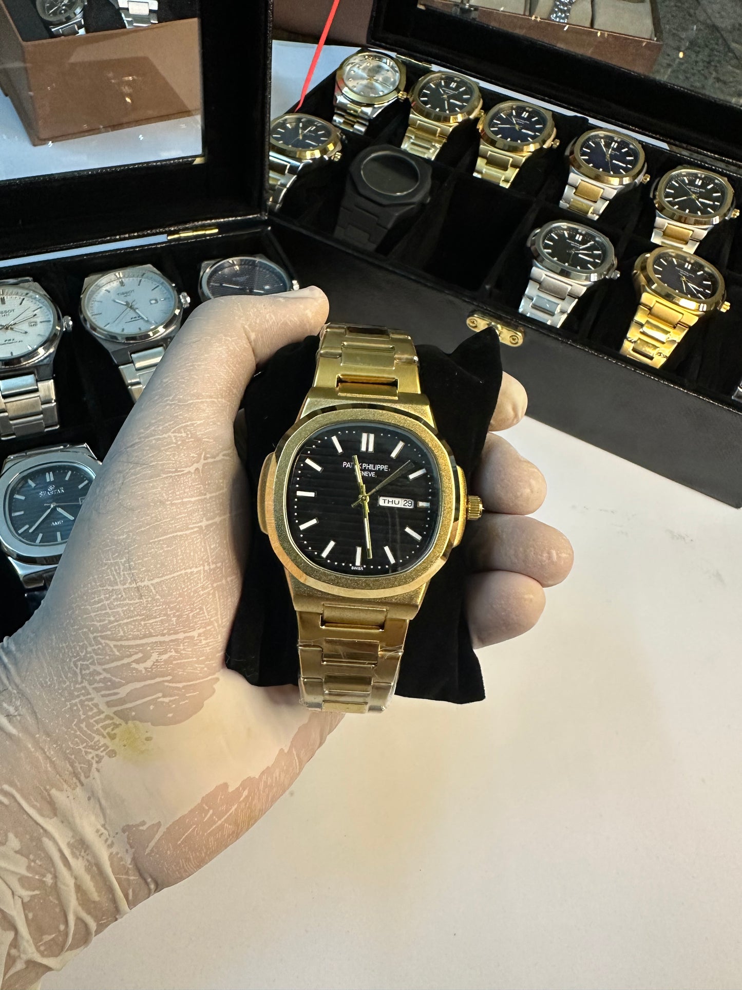 Patek philippe golden watch with black dail